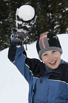 United States, Washington, boy (age 10) with snowball on Crystal Mountain (MR)