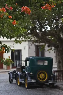 Images Dated 21st February 2009: Uruguay, Colonia Department, Colonia del Sacramento. Vintage cars, Calle Comercio