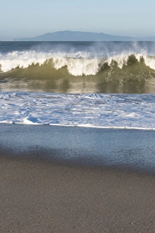 Ventura County Prints: US, CA, Oxnard. Offshore wind blows spray back from waves. Channel Islands on horizon