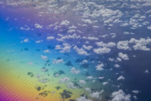 U.S. Virgin Islands, St. Thomas. Aerial view of clouds and rainbow over the Caribbean Sea