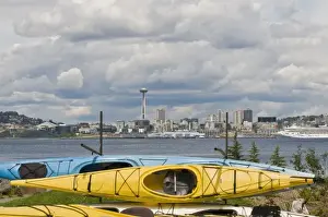 Elliott Bay Prints: US, WA, Seattle. Kayaks on racks in West Seattle frame the downtown Seattle skyline