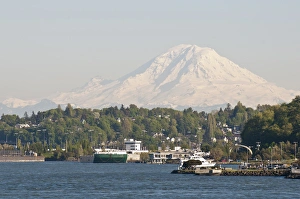 Elliott Bay Prints: US, WA, West Seattle. Water taxi approaches Seacrest Dock. Mount Rainier looms to south