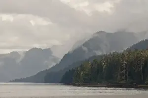 Images Dated 11th August 2011: USA, AK, Inside Passage. Classic Inside Passage scenery, light breaks through clouds