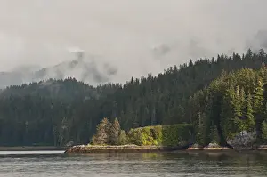 Images Dated 11th August 2011: USA, AK, Inside Passage. Classic Inside Passage scenery, light breaks through clouds