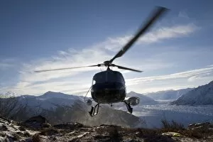 USA, Alaksa, Helicopter landing on summit of Lions Head peak above Matanuska Glacier