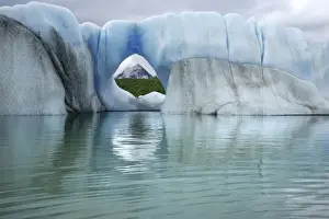 Berg Prints: USA, Alaska, Alsek Lake. View of mountain through hole in iceberg