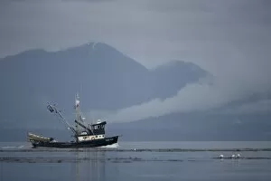 Images Dated 16th July 2007: USA, Alaska, Angoon, FV Lady Jane, a salmon fishing boat, motors past fog-shrouded