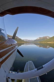 Stillness Prints: USA, Alaska, Arctic National Park. Float plane parked in the still waters of Lake