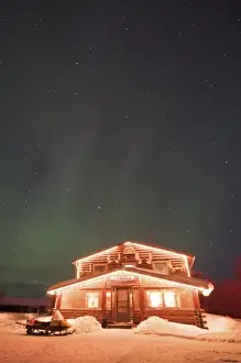Aurora Prints: USA, Alaska, Bettles. The landmark Bettles Lodge lit beneath the northern lights
