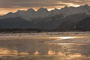 Chilkat River Prints: USA, Alaska, Chilkat River. Mountains reflect off icy river at sunset