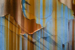 USA, Alaska, Craig. Rust streaks and peeling paint on old travel trailer. Credit as