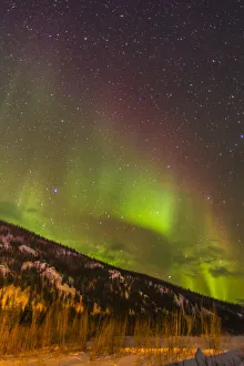 Images Dated 12th May 2020: USA, Alaska, Fairbanks. Aurora borealis over mountain landscape