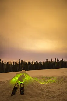 Away From It All Prints: USA, Alaska, Fairbanks. Quinzhee snow hut with snowshoes and poles