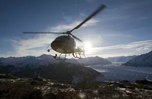 USA, Alaska, Helicopter landing on summit of Lions Head peak above Matanuska Glacier