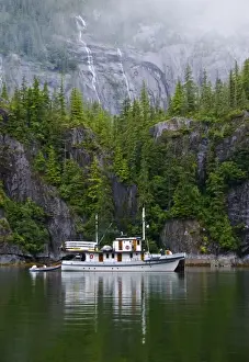 Anchored Prints: USA, Alaska, Inside Passage. Old boat anchored along shore
