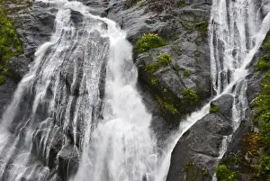 Rushing Prints: USA, Alaska, Inside Passage. Waterfalls rush down rock face