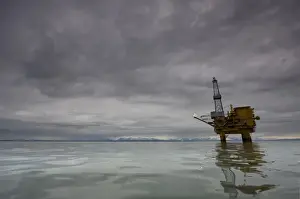 USA, Alaska, Kenai Peninsula, Offshore oil drilling rigs in Cook Inlet on summer evening