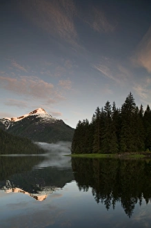 Images Dated 27th June 2007: USA, Alaska, Misty Fjords National Monument, Setting sun lights snowcapped mountain