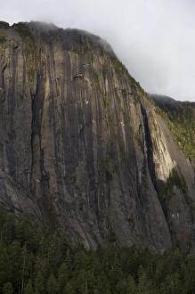 Images Dated 25th June 2007: USA, Alaska, Misty Fjords National Monument, Setting sun lights cliffs above Rudyerd