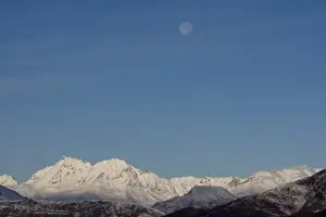 Images Dated 27th October 2007: USA, Alaska, Full moon above Chugach Range mountain peaks in early winter