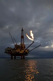 Cook Inlet Prints: USA, Alaska, Natural gas flare from offshore oil drilling rig in Cook Inlet on summer
