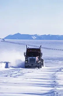 North Slope Prints: USA, Alaska, North Slope. Truck on the snow-covered Dalton highway with Trans-Alaska