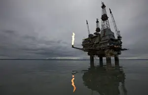 Cook Inlet Prints: USA, Alaska, Offshore oil drilling rig with burning natural gas flare in Cook Inlet