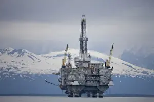 Images Dated 24th June 2008: USA, Alaska, Offshore oil drilling rig in Cook Inlet and distant Alaska Range peaks