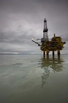 Cloudy Prints: USA, Alaska, Offshore oil drilling rig in Cook Inlet on summer evening