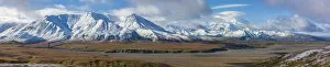 USA, Alaska. Panoramic view of Fall colors in Denali National Park with clouds shrouding