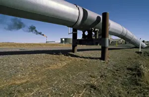 Fuel Prints: USA, Alaska, Prudhoe Bay. Gas flare billows black smoke over arctic tundra