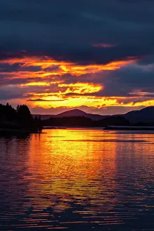 Images Dated 23rd June 2023: USA, Alaska, Sitka. Sunset on ocean and mountain landscape