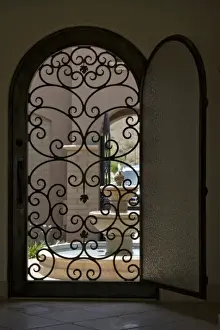 Buckeye Prints: USA, Arizona, Buckeye. View of fountain through open door of home in Verrado Village