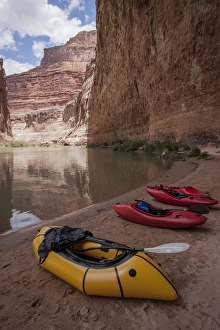 USA, Arizona, Grand Canyon National Park. Kayaks lie on the beach at Red Wall Cavern