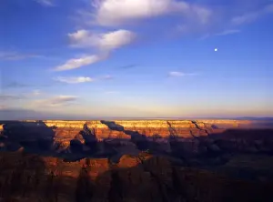 North Rim Prints: USA, Arizona, Grand Canyon NP. Moon in sky as sunrise lights the Sagittarius Ridge