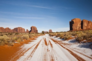 Navajo Prints: USA, Arizona, Monument Valley Navajo Tribal Park. Park road with snow