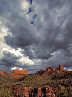Oak Creek Canyon Prints: USA, Arizona, Oak Creek Canyon. Menacing clouds race through the red rocks of Oak
