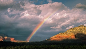 Rainbow Prints: USA, Arizona. Sunrise rainbow over mountain and valley landscape