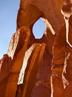 Images Dated 27th September 2010: USA, Arizona / Utah, Monument Valley Navajo Tribal Park, Suns Eye and candle formation