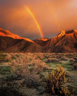 Images Dated 14th December 2022: USA, California, Anza-Borrego Desert State Park. Rainbow over desert mountains at sunrise