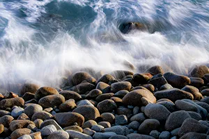 Crashing Prints: USA, California, Big Sur. Boulders along the shoreline as the waves come crashing in