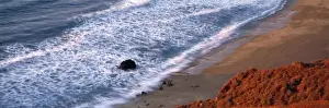 Monterey County Prints: USA, California, Big Sur. The sunset casts a reddish glow on the bluffs near Big Sur