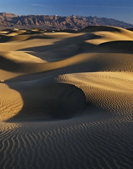 Heat Prints: USA, California, Death Valley National Park, View of sand dunes at sunset