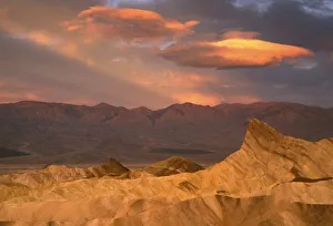 Manly Beacon Prints: USA, California, Death Valley National Park. Dramatic morning sky lights Manly Beacon