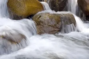 USA, California, Horse Creek. Water cascades over colorful rocks in Horse Creek in