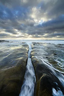 Christopher Talbot Frank Prints: USA, California, La Jolla. Wave flows through cracked sandstone