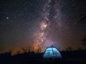 Milky Way Prints: USA, California, Mojave Desert. An illuminated tent against a starry sky and the Milky Way