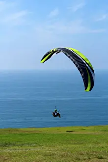 USA, California, San Diego. Hang glider taking off at Torrey Pines Gliderport. Credit as