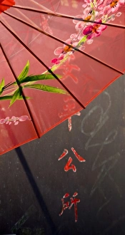 Character Prints: USA, California, San Francisco. Detailed image of red Chinese umbrella and painted