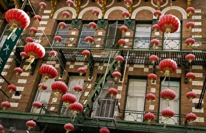 USA, California, San Francisco. Strings of red Chinese lanterns hanging from a balcony